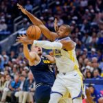 Oct 23, 2025; San Francisco, California, USA; Denver Nuggets center Nikola Jokic (15) is defended by Golden State Warriors center Al Horford (20) during the second quarter at Chase Center. Mandatory Credit: Bob Kupbens-Imagn Images