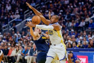 Oct 23, 2025; San Francisco, California, USA; Denver Nuggets center Nikola Jokic (15) is defended by Golden State Warriors center Al Horford (20) during the second quarter at Chase Center. Mandatory Credit: Bob Kupbens-Imagn Images