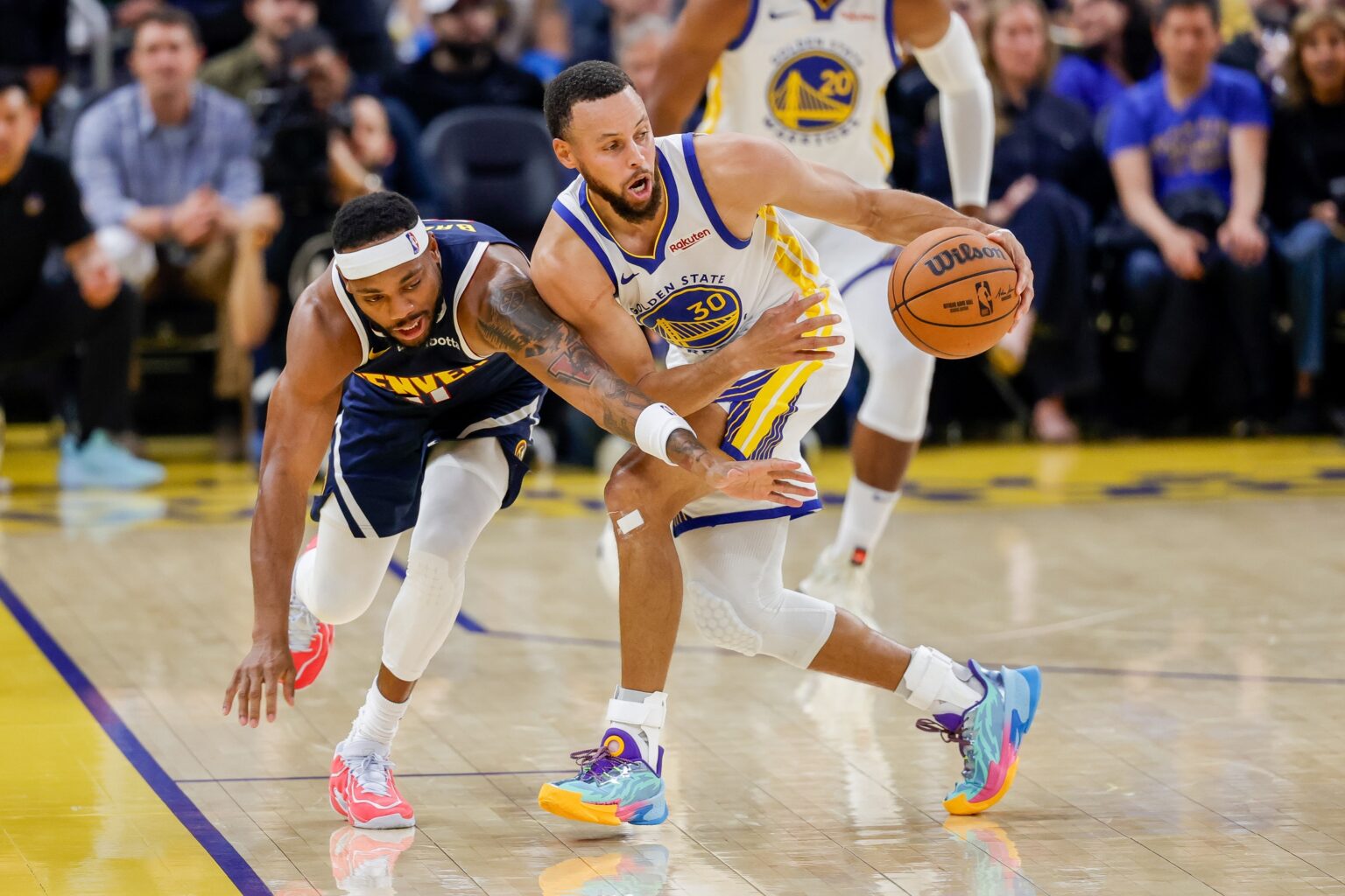 Oct 23, 2025; San Francisco, California, USA; Golden State Warriors guard Stephen Curry (30) steals the ball from Denver Nuggets guard Bruce Brown (11) during the second quarter at Chase Center. Mandatory Credit: Bob Kupbens-Imagn Images
