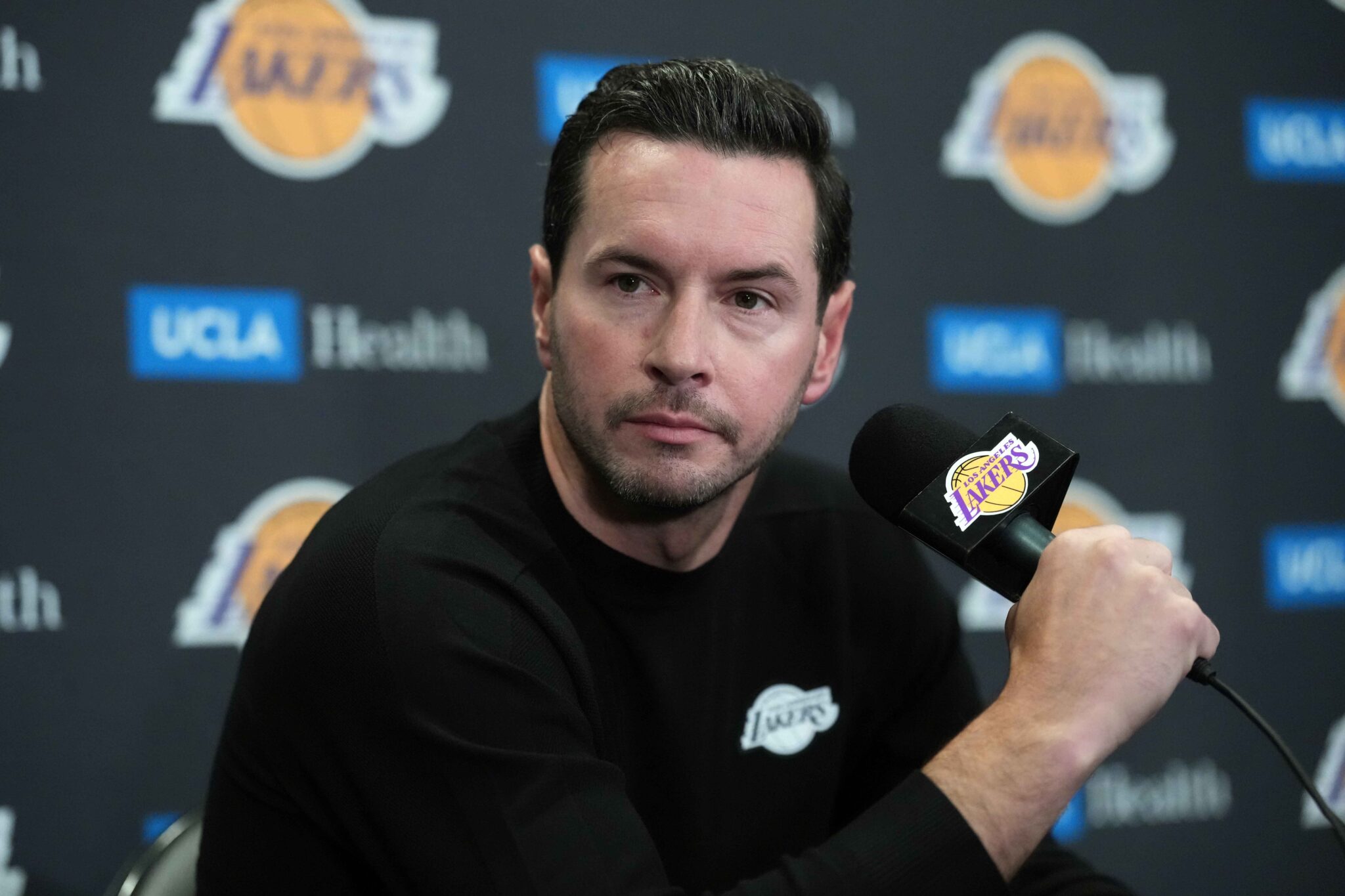 Oct 24, 2025; Los Angeles, California, USA; Los Angeles Lakers head coach JJ Redick at a press conference at Crypto.com Arena. Mandatory Credit: Kirby Lee-Imagn Images
