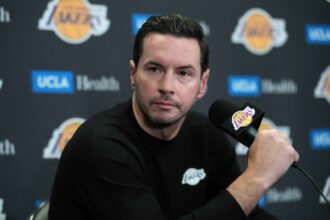 Oct 24, 2025; Los Angeles, California, USA; Los Angeles Lakers head coach JJ Redick at a press conference at Crypto.com Arena. Mandatory Credit: Kirby Lee-Imagn Images