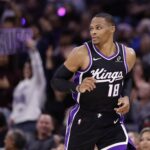Oct 24, 2025; Sacramento, California, USA; A Sacramento Kings fan holds a sign reading “Russ” after guard Russell Westbrook (18) scores a three point basket against the Utah Jazz during the fourth quarter at Golden 1 Center. Mandatory Credit: Kelley L Cox-Imagn Images