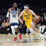 Oct 24, 2025; Los Angeles, California, USA; Los Angeles Lakers guard Austin Reaves (15) dribbles the ball against Minnesota Timberwolves guard Mike Conley (10) in the second half at Crypto.com Arena. Mandatory Credit: Kirby Lee-Imagn Images