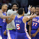 Oct 25, 2025; Philadelphia, Pennsylvania, USA; Philadelphia 76ers guard Quentin Grimes (5) celebrates with teammates after his score in the closing seconds of the fourth quarter against the Charlotte Hornets at Xfinity Mobile Arena. Mandatory Credit: Bill Streicher-Imagn Images