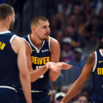 Oct 25, 2025; Denver, Colorado, USA; Denver Nuggets center Nikola Jokic (15) reacts after being called for a foul during the first half against the Phoenix Suns at Ball Arena. Mandatory Credit: Christopher Hanewinckel-Imagn Images