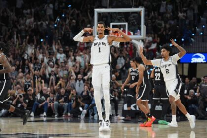 Oct 26, 2025; San Antonio, Texas, USA; San Antonio Spurs forward Victor Wembanyama (1) celebrates a three-point shot in the second half against the Brooklyn Nets at Frost Bank Center. Mandatory Credit: Daniel Dunn-Imagn Images