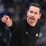 Oct 26, 2025; Sacramento, California, USA; Los Angeles Lakers head coach JJ Redick makes a call to the bench during the first quarter of the game against the Sacramento Kings at Golden 1 Center. Mandatory Credit: Ed Szczepanski-Imagn Images