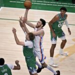 Oct 27, 2025; Dallas, Texas, USA; Oklahoma City Thunder center Chet Holmgren (7) drives to the basket past Dallas Mavericks forward Cooper Flagg (32) during the first quarter at the American Airlines Center. Mandatory Credit: Jerome Miron-Imagn Images