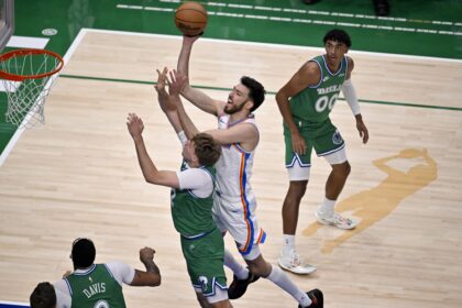 Oct 27, 2025; Dallas, Texas, USA; Oklahoma City Thunder center Chet Holmgren (7) drives to the basket past Dallas Mavericks forward Cooper Flagg (32) during the first quarter at the American Airlines Center. Mandatory Credit: Jerome Miron-Imagn Images