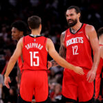 Oct 27, 2025; Houston, Texas, USA; Houston Rockets center Steven Adams (12) talks with Houston Rockets guard Reed Sheppard (15) after the first quarter against the Brooklyn Nets at Toyota Center. Mandatory Credit: Erik Williams-Imagn Images