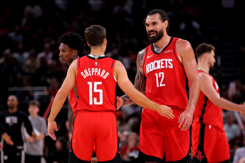 Oct 27, 2025; Houston, Texas, USA; Houston Rockets center Steven Adams (12) talks with Houston Rockets guard Reed Sheppard (15) after the first quarter against the Brooklyn Nets at Toyota Center. Mandatory Credit: Erik Williams-Imagn Images