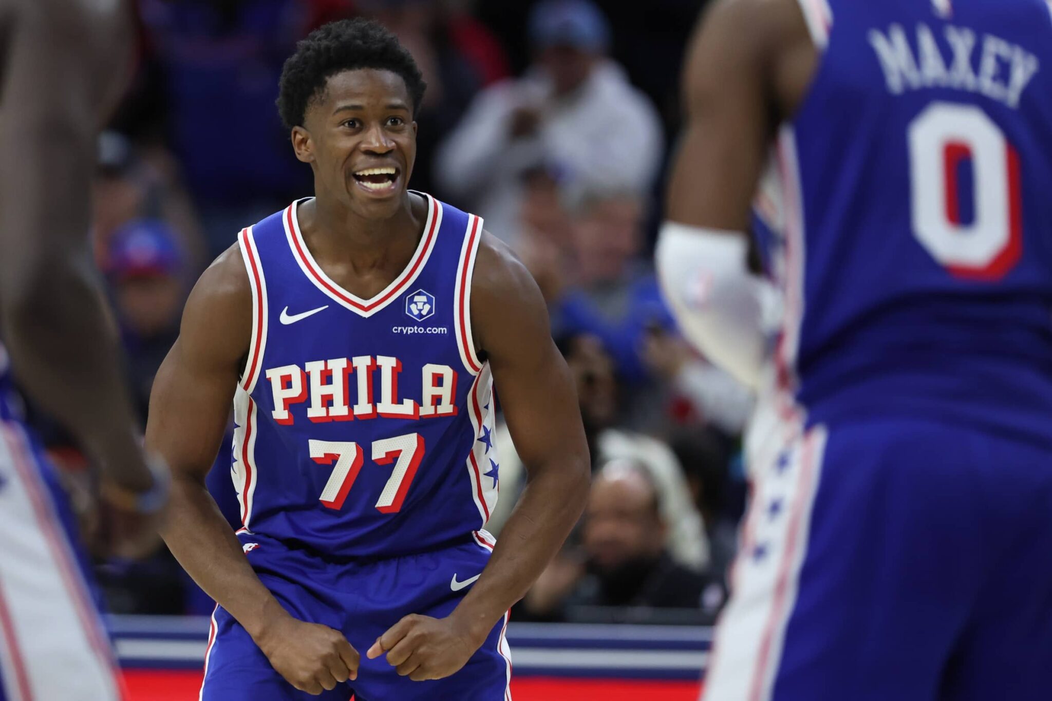 Philadelphia 76ers guard VJ Edgecombe (77) reacts to guard Tyrese Maxey (0) three pointer against the Orlando Magic during the fourth quarter at Xfinity Mobile Arena.
