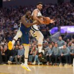 Oct 27, 2025; San Francisco, California, USA; Golden State Warriors forward Draymond Green (23) and Memphis Grizzlies forward Santi Aldama (7) battle for control of a rebound in the second quarter at the Chase Center. Mandatory Credit: Cary Edmondson-Imagn Images