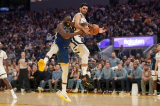 Oct 27, 2025; San Francisco, California, USA; Golden State Warriors forward Draymond Green (23) and Memphis Grizzlies forward Santi Aldama (7) battle for control of a rebound in the second quarter at the Chase Center. Mandatory Credit: Cary Edmondson-Imagn Images