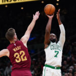 Oct 29, 2025; Boston, Massachusetts, USA; Boston Celtics guard/forward Jaylen Brown (7) shoots the ball against Cleveland Cavaliers forward/center Dean Wade (32) in the last seconds of the second quarter at TD Garden. Mandatory Credit: David Butler II-Imagn Images