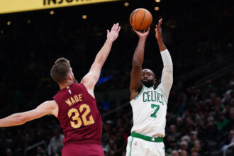 Oct 29, 2025; Boston, Massachusetts, USA; Boston Celtics guard/forward Jaylen Brown (7) shoots the ball against Cleveland Cavaliers forward/center Dean Wade (32) in the last seconds of the second quarter at TD Garden. Mandatory Credit: David Butler II-Imagn Images