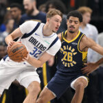 Oct 29, 2025; Dallas, Texas, USA; Dallas Mavericks forward Cooper Flagg (32) moves to the basket past Indiana Pacers guard Ben Sheppard (26) during the first quarter at the American Airlines Center. Mandatory Credit: Jerome Miron-Imagn Images