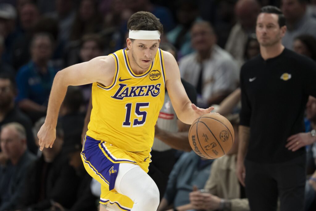 Oct 29, 2025; Minneapolis, Minnesota, USA; Los Angeles Lakers guard Austin Reaves (15) dribbles the ball against the Minnesota Timberwolves in the second half at Target Center. Mandatory Credit: Jesse Johnson-Imagn Images
