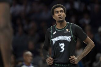 Timberwolves forward Jaden McDaniels looks on against the Lakers in the second half at Target Center