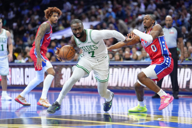 Oct 31, 2025; Philadelphia, Pennsylvania, USA; Boston Celtics forward Jaylen Brown (7) drives against Philadelphia 76ers guard Tyrese Maxey (0) in the first quarter at Xfinity Mobile Arena. Mandatory Credit: Kyle Ross-Imagn Images