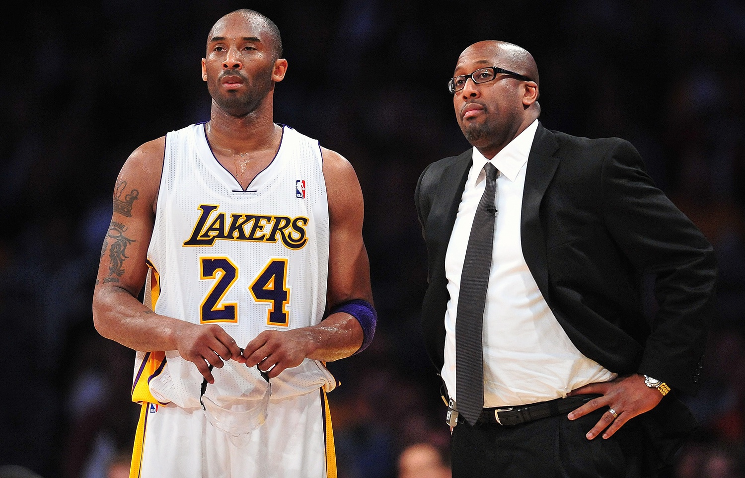March 11, 2012; Los Angeles, CA, USA; Los Angeles Lakers shooting guard Kobe Bryant (24) and head coach Mike Brown during a stoppage in play against the Boston Celtics during the second half at Staples Center. Mandatory Credit: Gary A. Vasquez-USA TODAY Sports