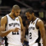 Jun 11, 2013; San Antonio, TX, USA; San Antonio Spurs power forward Tim Duncan (21) talks with small forward Kawhi Leonard (2) during the first quarter of game three of the 2013 NBA Finals against the Miami Heat at the AT&T Center. Mandatory Credit: Soobum Im-Imagn Images