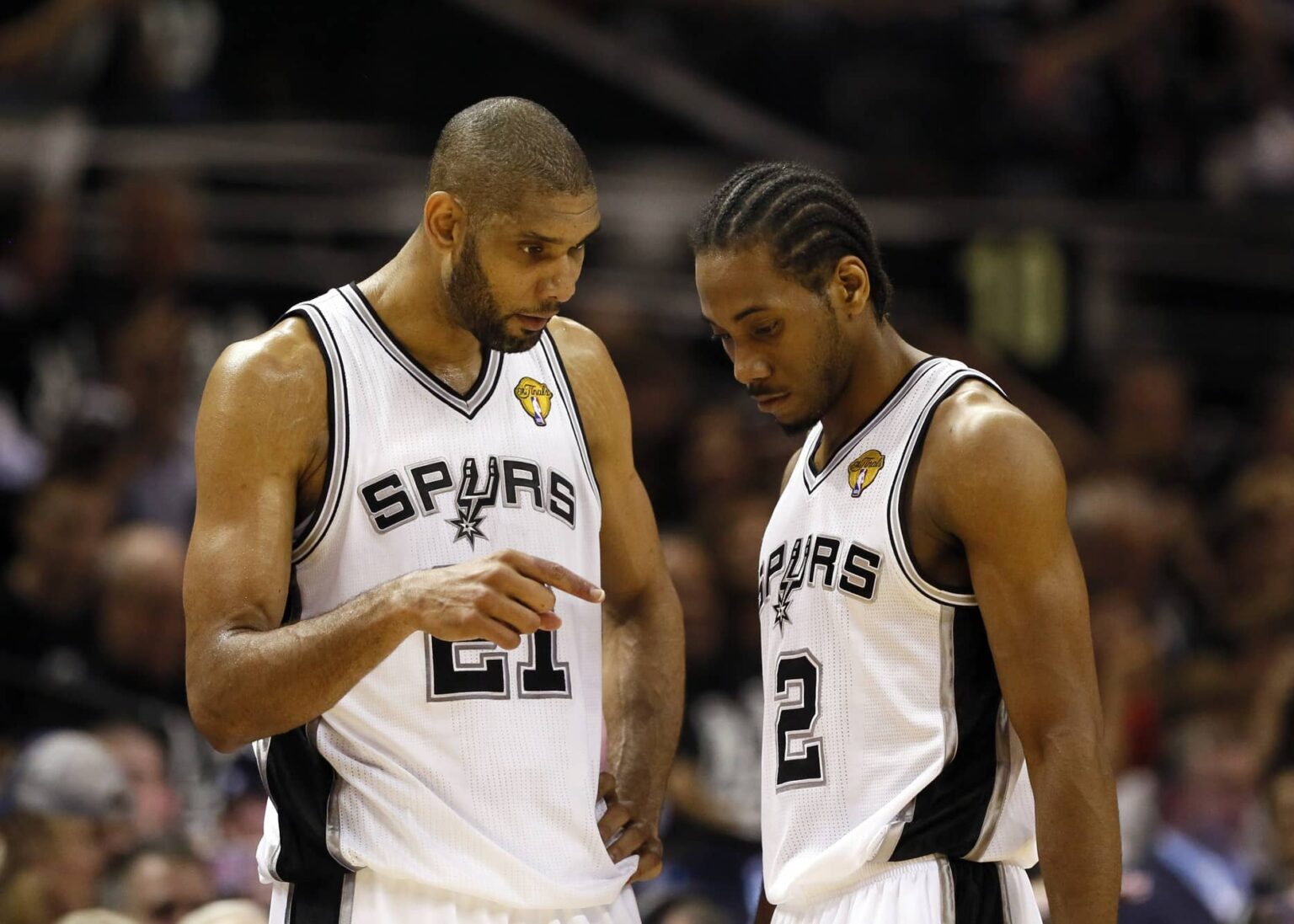 Jun 11, 2013; San Antonio, TX, USA; San Antonio Spurs power forward Tim Duncan (21) talks with small forward Kawhi Leonard (2) during the first quarter of game three of the 2013 NBA Finals against the Miami Heat at the AT&T Center. Mandatory Credit: Soobum Im-Imagn Images