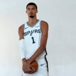 Spurs forward-center Victor Wembanyama poses for photos during Media Day at Victory Capital Performance Center in San Antonio