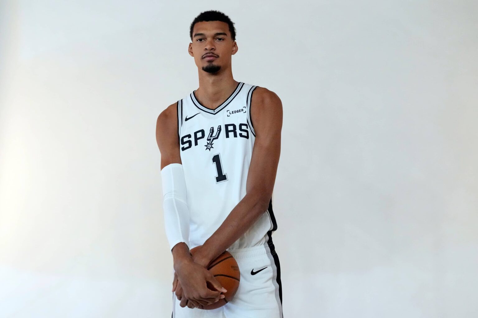 Spurs forward-center Victor Wembanyama poses for photos during Media Day at Victory Capital Performance Center in San Antonio