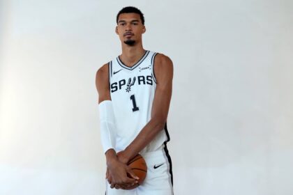 Spurs forward-center Victor Wembanyama poses for photos during Media Day at Victory Capital Performance Center in San Antonio