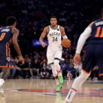 Nov 8, 2024; New York, New York, USA; Milwaukee Bucks forward Giannis Antetokounmpo (34) brings the ball up court against New York Knicks forward OG Anunoby (😎 and guard Jalen Brunson (11) during the first quarter at Madison Square Garden. Mandatory Credit: Brad Penner-Imagn Images