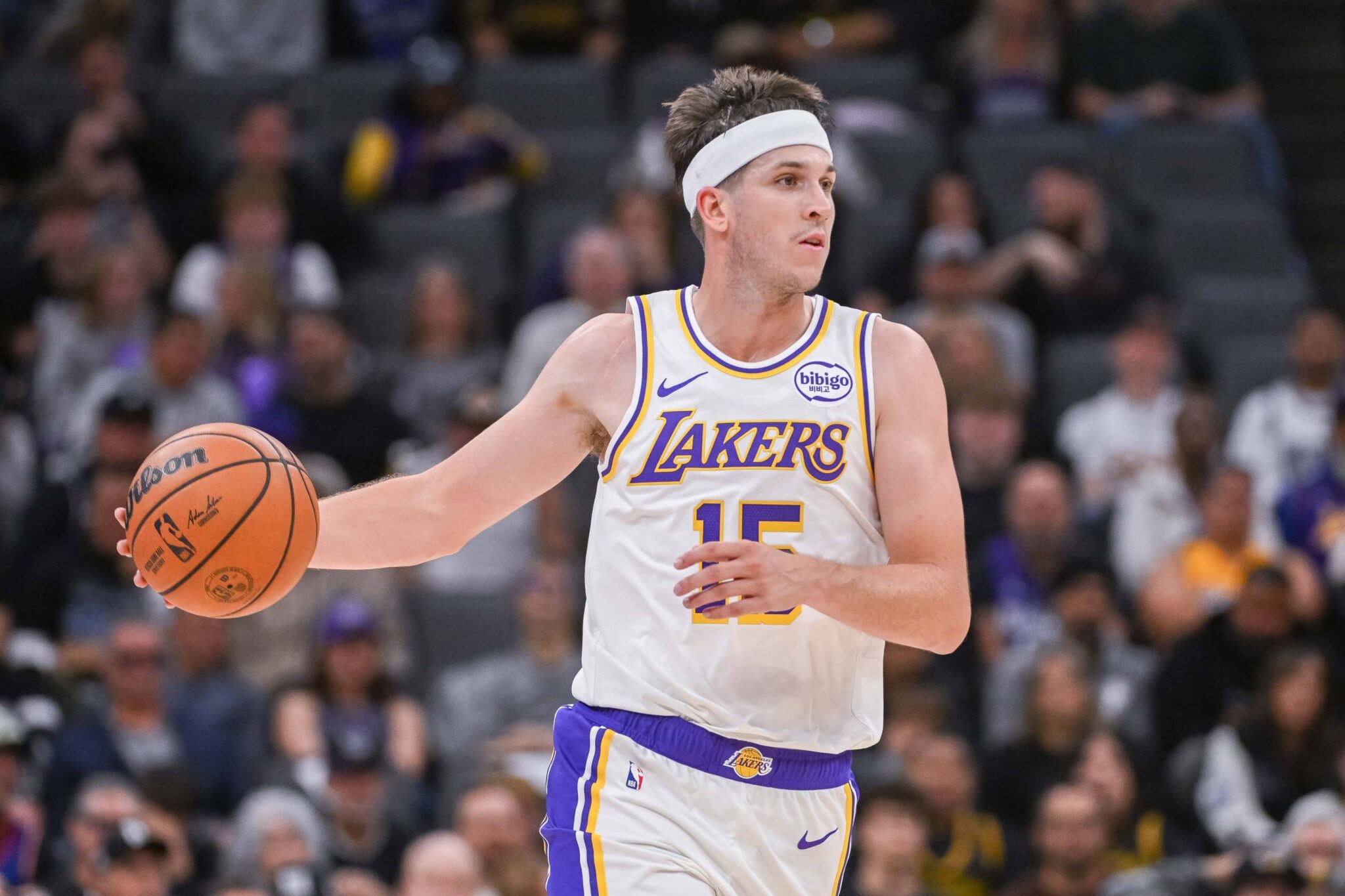 Sacramento, California, USA; Los Angeles Lakers guard Austin Reaves (15) controls the ball against the Sacramento Kings during the second quarter at Golden 1 Center. Mandatory Credit: Ed Szczepanski-Imagn Images