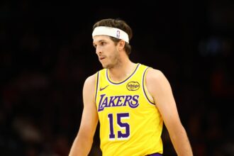 Phoenix, Arizona, USA; Los Angeles Lakers guard Austin Reaves (15) against the Phoenix Suns during an NBA preseason game at Mortgage Matchup Center. Mandatory Credit: Mark J. Rebilas-Imagn Images