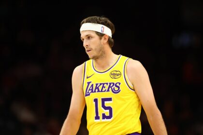 Phoenix, Arizona, USA; Los Angeles Lakers guard Austin Reaves (15) against the Phoenix Suns during an NBA preseason game at Mortgage Matchup Center. Mandatory Credit: Mark J. Rebilas-Imagn Images