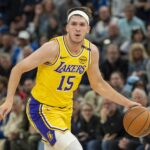 Minneapolis, Minnesota, USA; Los Angeles Lakers guard Austin Reaves (15) dribbles the ball against the Minnesota Timberwolves during Game 3 of the first round of the 2024 NBA Playoffs at Target Center. Mandatory Credit: Jesse Johnson-Imagn Images