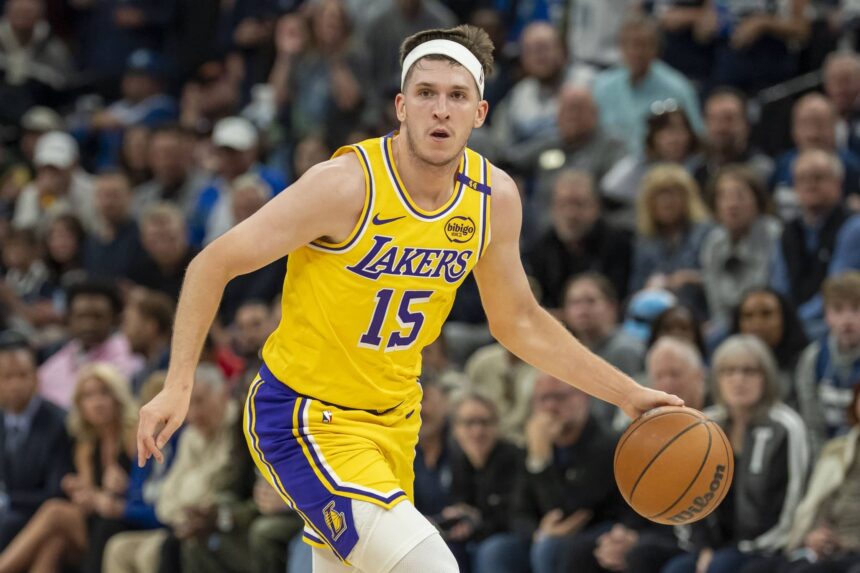 Minneapolis, Minnesota, USA; Los Angeles Lakers guard Austin Reaves (15) dribbles the ball against the Minnesota Timberwolves during Game 3 of the first round of the 2024 NBA Playoffs at Target Center. Mandatory Credit: Jesse Johnson-Imagn Images