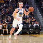 San Francisco, California, USA; Golden State Warriors guard Brandin Podziemski (2) dribbles upcourt against the Los Angeles Lakers in the third quarter at Chase Center. Mandatory Credit: David Gonzales-Imagn Images