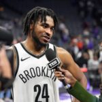 Sacramento, California, USA; Brooklyn Nets guard Cam Thomas (24) is interviewed after defeating the Sacramento Kings at Golden 1 Center. Mandatory Credit: Darren Yamashita-Imagn Images
