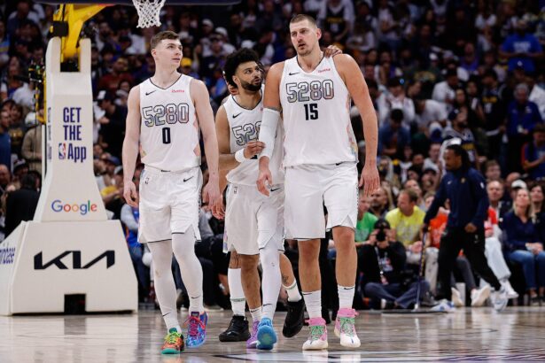 Denver, Colorado, USA; Denver Nuggets guard Jamal Murray (27), center Nikola Jokic (15) and guard Christian Braun (0) in the fourth quarter against the Oklahoma City Thunder during Game 6 of the second round of the 2025 NBA Playoffs at Ball Arena. Mandatory Credit: Isaiah J. Downing-Imagn Images