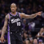 Sacramento, California, USA; Sacramento Kings forward/guard DeMar DeRozan (10) gestures between plays against the Utah Jazz during the second quarter at Golden 1 Center. Mandatory Credit: Kelley L Cox-Imagn Images