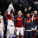 Dallas, Texas, USA; The Denver Nuggets team bench celebrates during the second half of the game against the Dallas Mavericks at the American Airlines Center. Mandatory Credit: Jerome Miron-Imagn Images