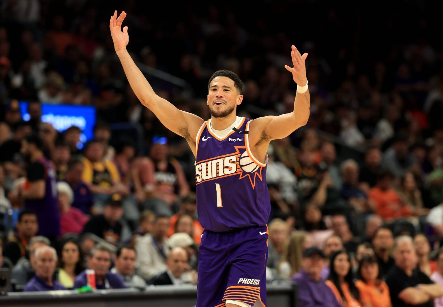 Phoenix, Arizona, USA; Phoenix Suns guard Devin Booker (1) reacts against the Golden State Warriors at Footprint Center. Mandatory Credit: Mark J. Rebilas-Imagn Images