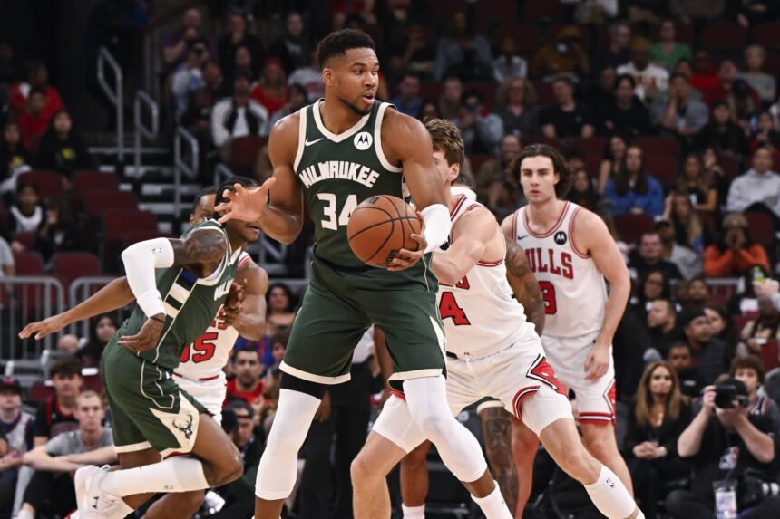Chicago, Illinois, USA; Milwaukee Bucks forward Giannis Antetokounmpo (34) grabs the ball against the Chicago Bulls during the first half at the United Center. Mandatory Credit: Matt Marton-Imagn Images