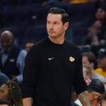 San Francisco, California, USA; Los Angeles Lakers head coach JJ Redick watches the action against the Golden State Warriors in the first quarter at Chase Center. Mandatory Credit: David Gonzales-Imagn Images