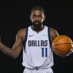 Dallas, TX, USA; Dallas Mavericks guard Kyrie Irving (11) poses for a photo during the Mavericks 2025 media day at the American Airlines Center. Mandatory Credit: Jerome Miron-Imagn Images