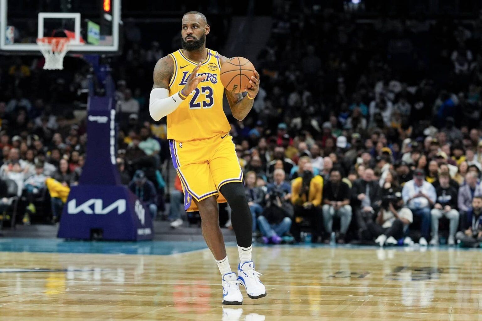 Charlotte, North Carolina, USA; Los Angeles Lakers forward LeBron James (23) brings the ball up court against the Charlotte Hornets during the first quarter at the Spectrum Center. Mandatory Credit: Jim Dedmon-Imagn Images