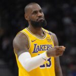 Toronto, Ontario, CAN; Los Angeles Lakers forward LeBron James (23) gestures to a teammate during the first half against the Toronto Raptors at Scotiabank Arena. Mandatory Credit: John E. Sokolowski-Imagn Images