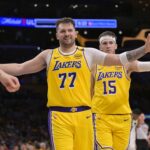 Los Angeles, California, USA; Los Angeles Lakers guard Luka Doncic (77) and guard Austin Reaves (15) react after a basket against the Utah Jazz at Crypto.com Arena. Mandatory Credit: Jayne Kamin-Oncea-Imagn Images