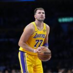 Los Angeles, California, USA; Los Angeles Lakers guard Luka Doncic (77) shoots a free throw in the second half against the Minnesota Timberwolves at Crypto.com Arena. Mandatory Credit: Kirby Lee-Imagn Images