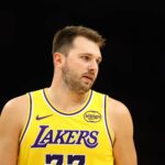 Phoenix, Arizona, USA; Los Angeles Lakers guard Luka Doncic (77) against the Phoenix Suns during an NBA preseason game at Mortgage Matchup Center. Mandatory Credit: Mark J. Rebilas-Imagn Images